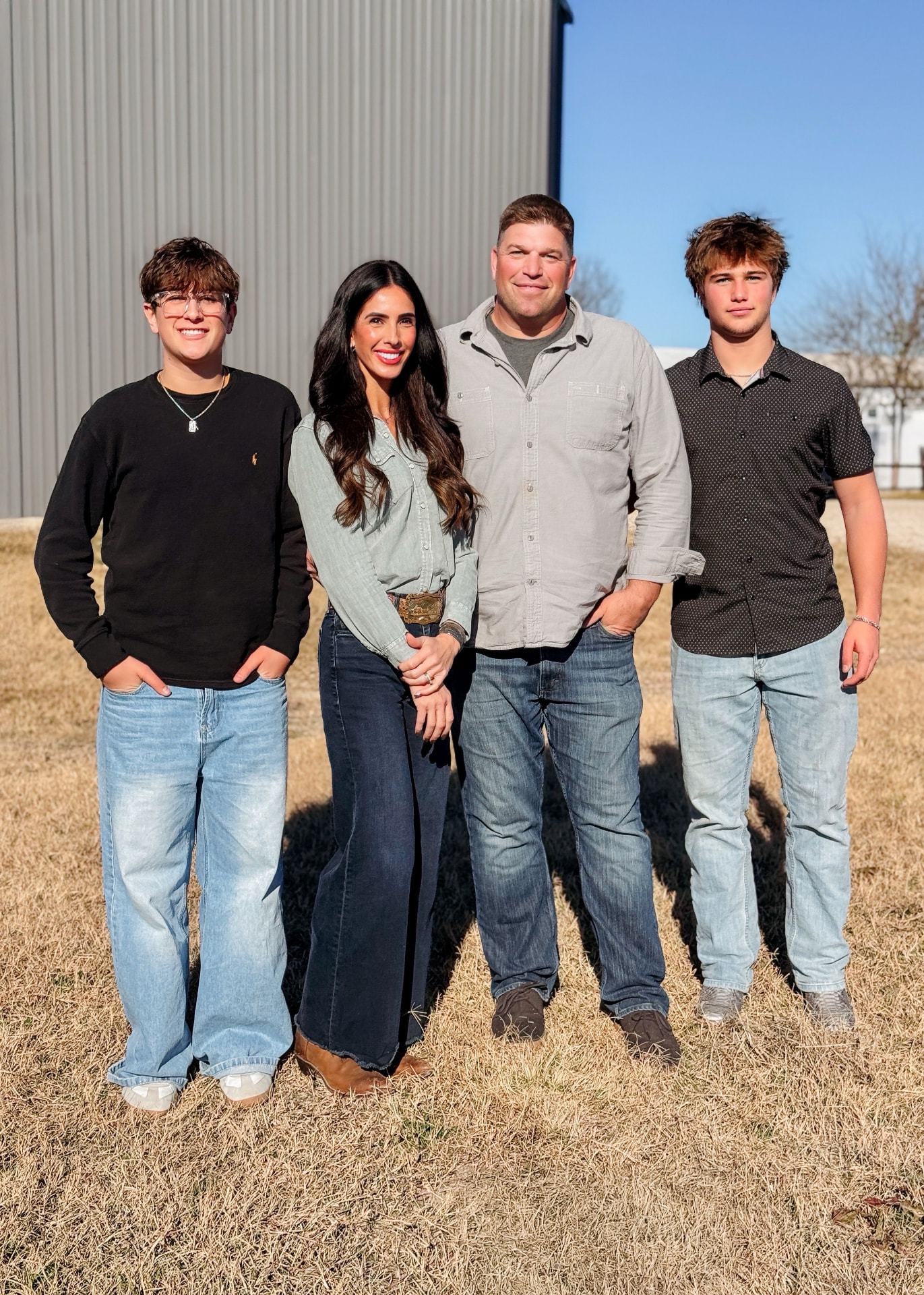 The family that owns and manages 1385 Business Park, standing in front of one of the park's grey metal flex buildings